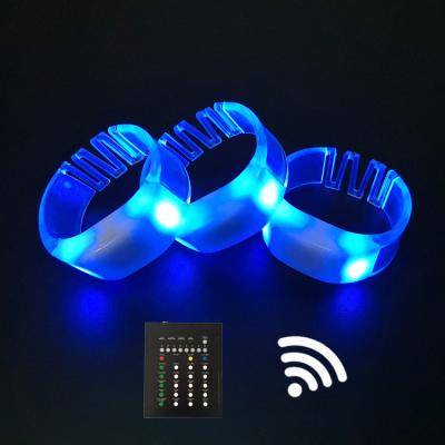 China ABS case+PVC bands+electric elements hot sales night clubs party LED luminous remote control wristband flashing wristband concerts for sale