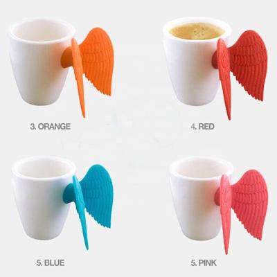 China Sustainable Fashion Creative Ceramic Mug Lovely With Silicone Angel Wings for sale