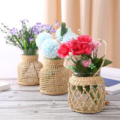 China Modern Rattan Dried Chinese Creative Glass Flower Vase Small Vase With Rattan Stand for sale