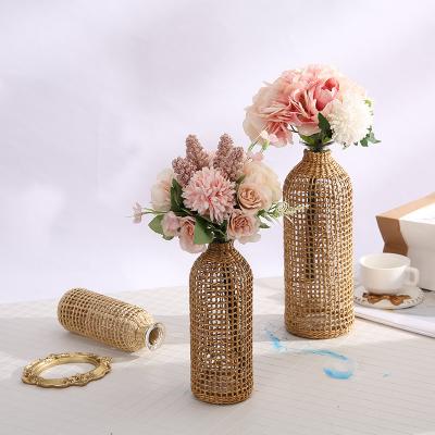 China New classic/postmodern export glass flower pot glass flower vase with rattan stand for home decor for sale