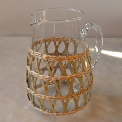 China Sustainable Glass Tea Water Jar With Rattan Holder for sale