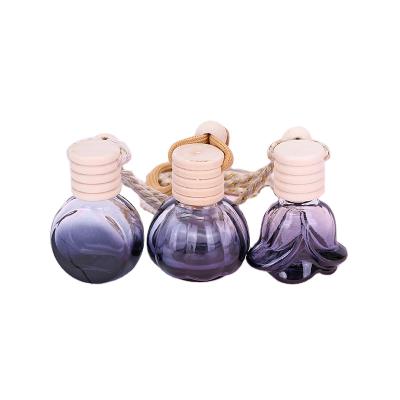 China Cosmetic Car Perfume Glass Bottle Black Empty Perfume Bottle Wood Hanging Car Aroma Diffuser Bottle for sale