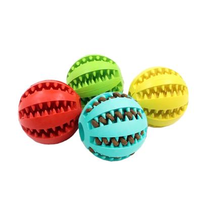 China Aggressive Treat Ball Food Puzzle Bite Pet Chew Toy Teeth Cleaning Dog Toothbrush Dispensing Concealing Ball for sale