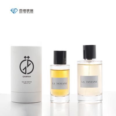 China Cosmetic Custom color Luxury clear cylindrical 50ml 100ml glass perfume bottle with box for sale