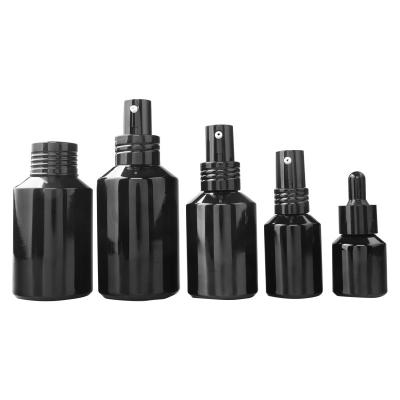 China 30ml 50ml Cosmetic Black Rolling Shoulder Bottles Empty Glass Mist Spray Bottles Dispenser Atomizer Glass Bottle for sale