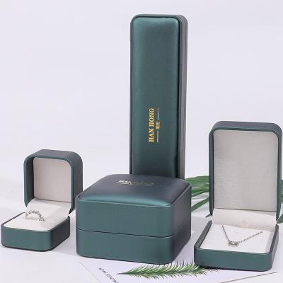 China Dark Green Convex Faux Leather Jewelry Storage Box Luxury Organizer Packaging for sale