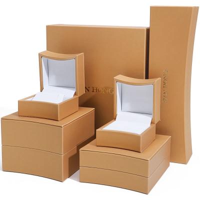 China Golden Arc Shaped Faux Leather Jewelry Box Luxury Jewelry Storage Packaging Case for sale