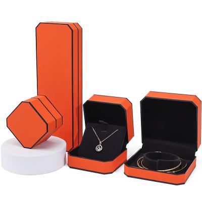 China Octagonal Orange Black Border PU Leather Jewelry Box Set for Luxury Packaging for sale