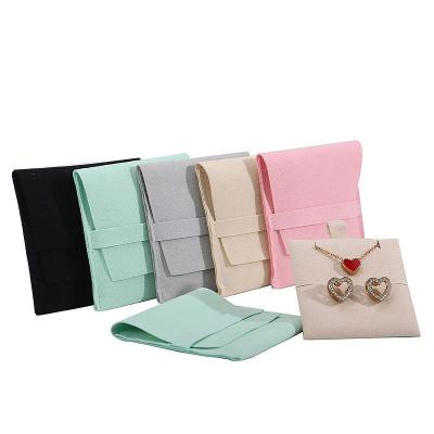 China Soft Touch Microfiber Jewelry Storage Pouch with Removable Divider for Earrings for sale