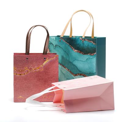 China Upscale Luxurious Firm Cardboard Paper Tote Bag Luxury Packaging With Handles for sale