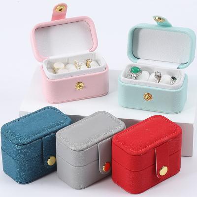 China Mini PU Leather Ear Stud Ring Storage Box Jewelry Holder With Button Closure for sale