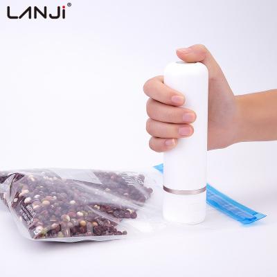 China Portable Household Cordless USB Rechargeable Mini Vacuum Pump Food Vacuum Sealer Machine Whole Set with Compressed Bags and 2 Crispers for sale