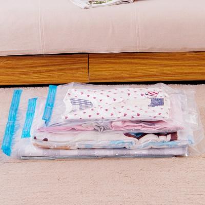 China Rolling Hand Compression Sustainable Vacuum Bag Border Collapsible Compressed Home Clothes Storage Bag Space Saving Seal Plastic Bags for sale