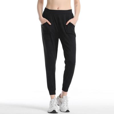 China QUICK DRY Loose Yoga Pants Cool Sport Pants High Quality Women's Yoga Pants With Pockets for sale