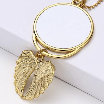 China Cute Amazon Angel Wings Car Accessories Double Sided Heat Transfer Silver and Gold Round Blank Sublimation Pendants for sale