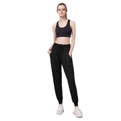 China Anti-pilling the latest design of casual pants with pockets elastic women's side waistband pants lady clothing for sale