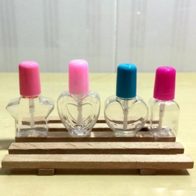 Κίνα 5ml Transparent Plastic Empty Nail Polished Bottle With many shape Brush Plastic Nail Bottle and many color for the cap προς πώληση