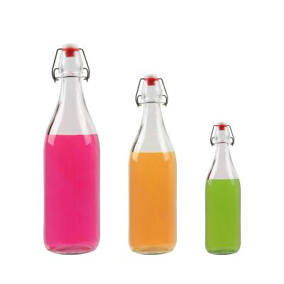 China 100ml 250ml 500ml 750ml 1000ml Clear Beverage Swing Top Beverage Beer Juice Beverage Glass Bottle Free Sample for sale