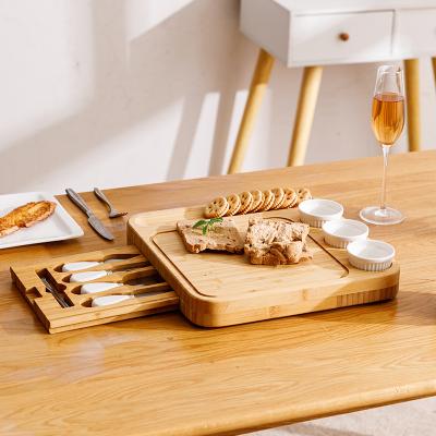 China Sustainable Bamboo Charcuterie Cheese Board with Magnetic Slide-out Drawer and 3 Ceramic Bowls for sale