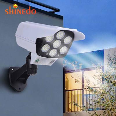 China Outdoor LANDSCAPE Camera Simulation Monitoring Security Lighting Outdoor Motion Sensor Solar Wall Lamp for sale