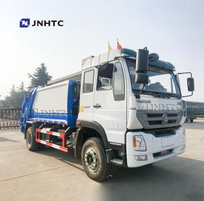 China Other State New SINOTRUK 9cbm 12cbm 7cbm Rear Loading Compactor Garbage Truck With 1.2cbm Waste Bin for sale