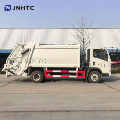 China Construction worksÂ   SINOTRUK HOWO small size garbage transport truck compressed type 4X2 6 tires discount price garbage collector rear loading truck for sale