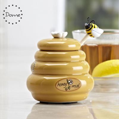 China Viable Wholesale Yellow Hives Form Ceramic Honey Jar With Plunger for sale