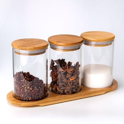 China Heatable Fully Stocked 3pcs Round Transparent Kitchen Spice Glass Jar Set With Wooden Lid Spoon Holder for sale