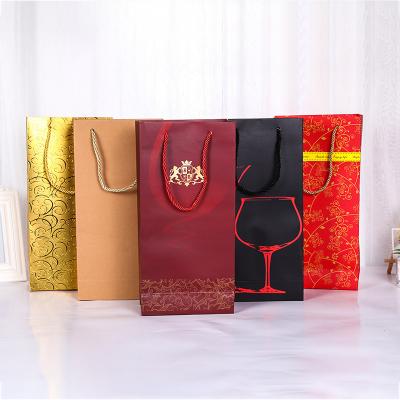 China Recycled Materials Yiwu Recycled Premium Logo Wine Bottle Shopping Gift Bag Custom Paper Packaging Bag With Rope Handles for sale