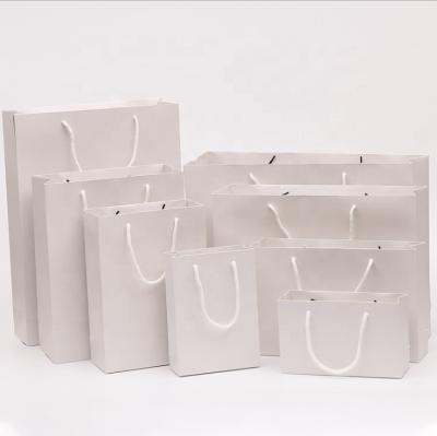 China Wholesale Recycled Materials Factory Card White Paper Bag With Handle Private Label Custom Logo For Present Gift Wine Food Clothing Packaging for sale