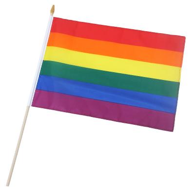 China Custom Multicolor Lgbt Gay Pride Wholesale Price Rainbow Stick Waving Hand Held Flag for sale