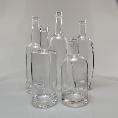 China Special Shaped Clear Round Glass Wine Bottles Wholesale 500ml 700ml 750ml Beverage Whiskey Glass Bottle Liquor Glass Bottle for sale