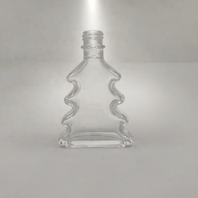 China Beverage Christmas Tree Shape Mini Liquor Bottle 200ml Brandy Liquor Bottle 200ml Juniper Glass Whiskey Bottle for sale