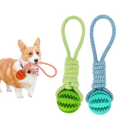 China New Dog Bite Toy Durable Heavy Duty Rubber Cotton Rope Leaking Pet Food Ball for sale