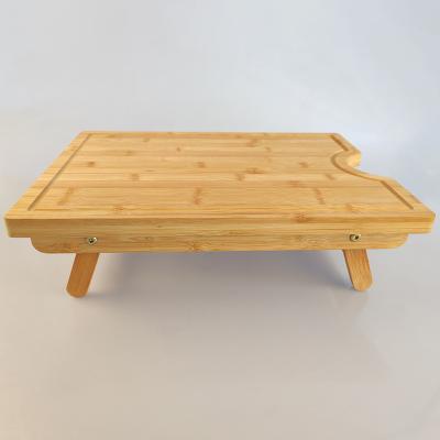 China New Design Sustainable Bamboo Wood Kitchen Tableware Large Folding Cutting Board With Foldable Legs for sale