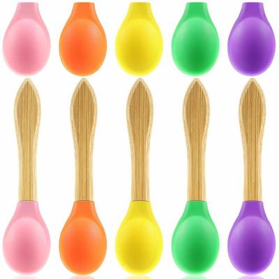 China Viable Free Custom BPA Grade Silicone Feeder Baby Spoon Logo Bamboo Baby Spoon Food With Wooden Handle for sale