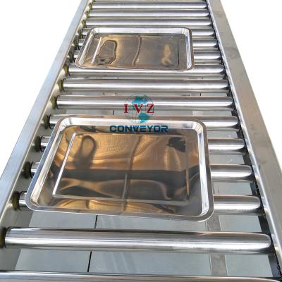 China Food/Beverage/Bags/Boxes/Tire Gravity Roller Conveyor with Induction Elevator System for Breadfruit in Tray Conveying for sale