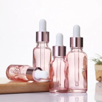 China Sustainable/Eco-friendly/Stocked Cosmetics Luxury Storage Dropper Pink Glass Bottles With Rose Gold Dropper For Essential Oil Body Care Eye Essence Face Serum for sale