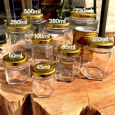 China StorageJar Kitchen Glass Jar Hexagonal Clear Empty Heatable Glass Pickle Jar For Honey Jam Pickle Container With Airtight Lids for sale