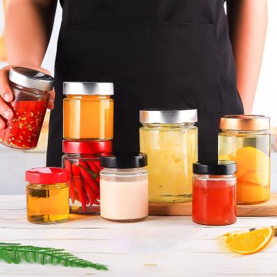 China Custom Stored Heatable All Size Straight Sided Glass Honey Pickles Jar Food Storage With Screw Metal Airtight Lid for sale