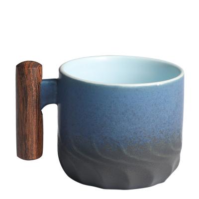 China Promotion Viable Hot Wholesale Tea Design Ceramic Coffee Mug With Wooden Handle for sale