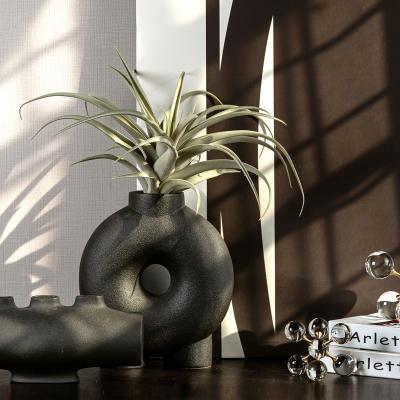 China Modern Nordic Unique Ceramic Black Donut Vase Design Decor Indoor Sculpture for sale