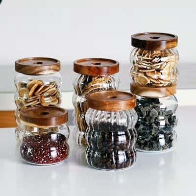 China New Heatable Arrive Kitchen Storage Jar Glass Canister With Acacia Wood Lid for sale