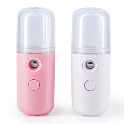 China Moisturizing Cream in Mini Handheld Moisture Face Nano Actions Portable Electric Mist Sprayer Facial Steamer for sale