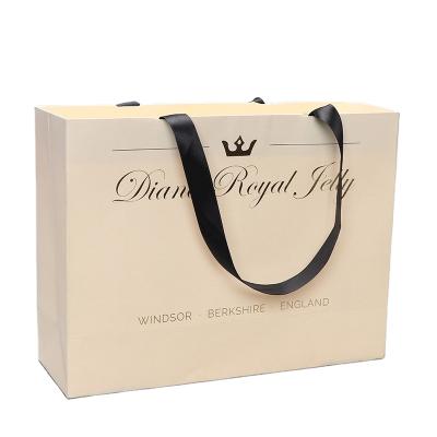 China 2021 custom rope handle china logo paper bag paper gift bag made in china with handle packaging bags for sale