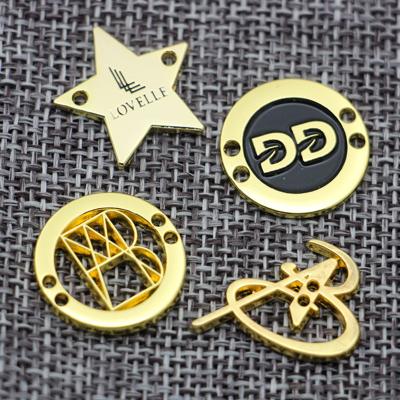 China Viable Fancy Design Garment Metal Brand Logo Metal Apparel Tags Decorative Bag Custom Metal Tags for sale