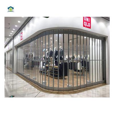 China Transparent Customized PVC Panels Durable Aluminum Commercial Store Crystal Glass Sliding Automatic Folding Doors for sale