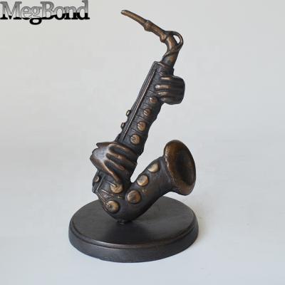 China Cast iron SAXOPHONE figurine from Europe for home decor for sale