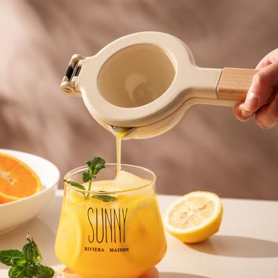 China Sustainable Premium Quality Manual Metal Squeezer Kitchen Instruments Wooden Handle Fruit Squeeze Tool For Lemon Orange Fruit Juice for sale