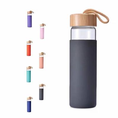 China New Design 500ml Sustainable Glass Water Bottle Custom Color For Silicone Sleeve With Bamboo Lid for sale